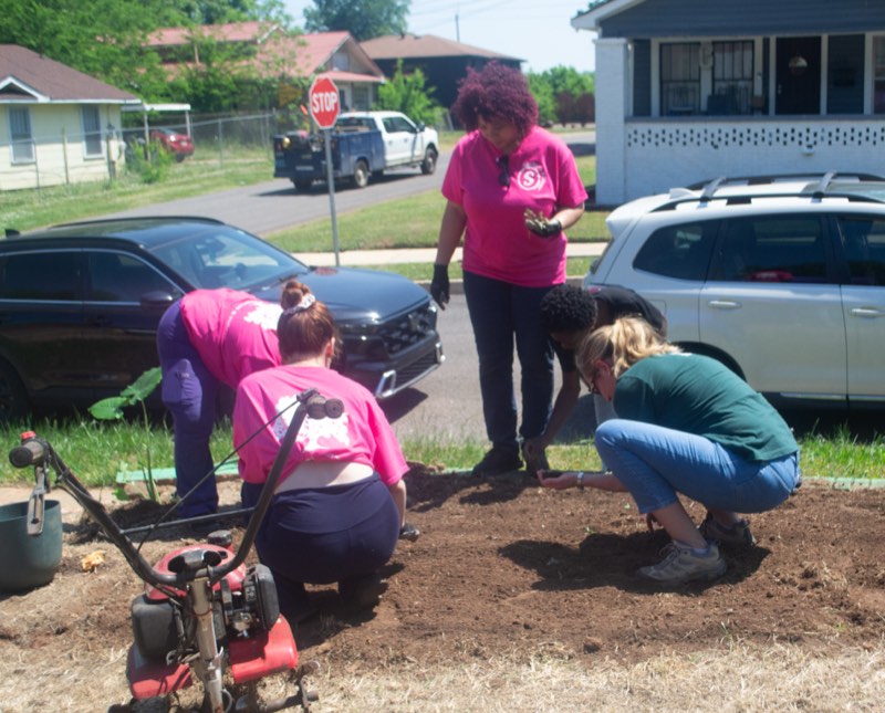 Volunteers planting at the South Titusville garden build